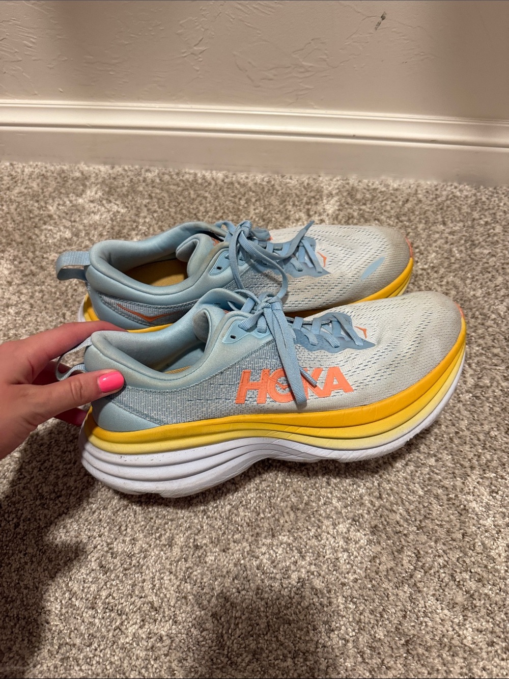 Hoka Light Blue Sneakers with Yellow and Orange Accents